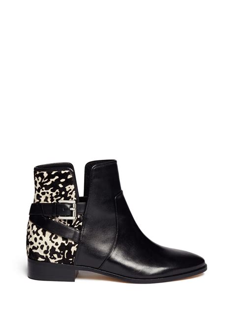 michael kors black white cow fur shoes|Michael Kors boots.